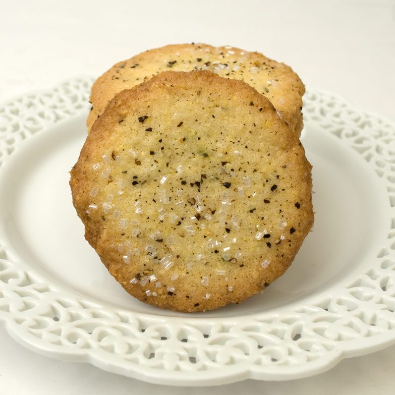 Stack of Cornmeal, Black Pepper & Rosemary Butter Cookies on a Plate