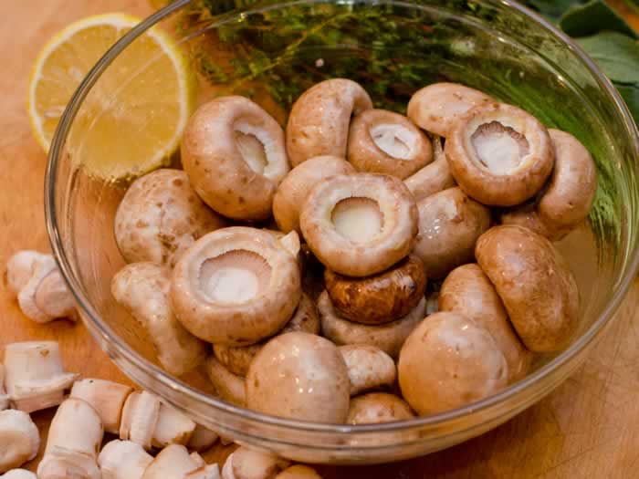 Preparing Mushrooms for Spicy Sausage Fresh Herb Stuffed Crimini Mushrooms