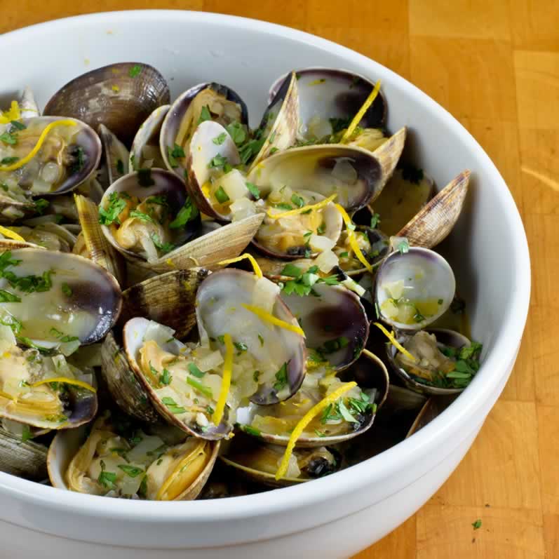 Hood Canal Manila Clams with Spicy Orange Cilantro Butter in a Bowl