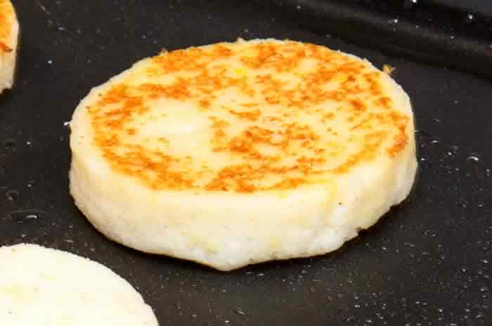 Arepas Sauteing on Griddle