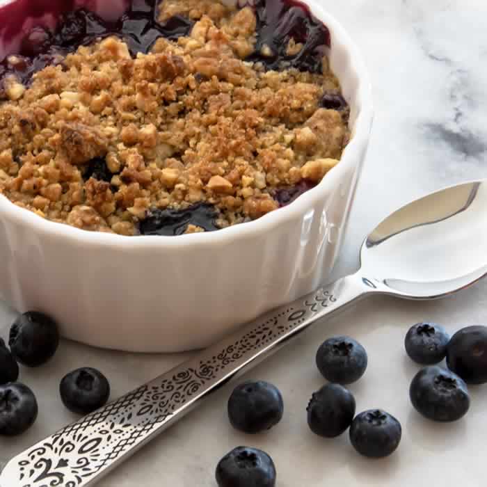 Ginger Lime Peach Blueberry Crisp with Toasted Hazelnut Streusel