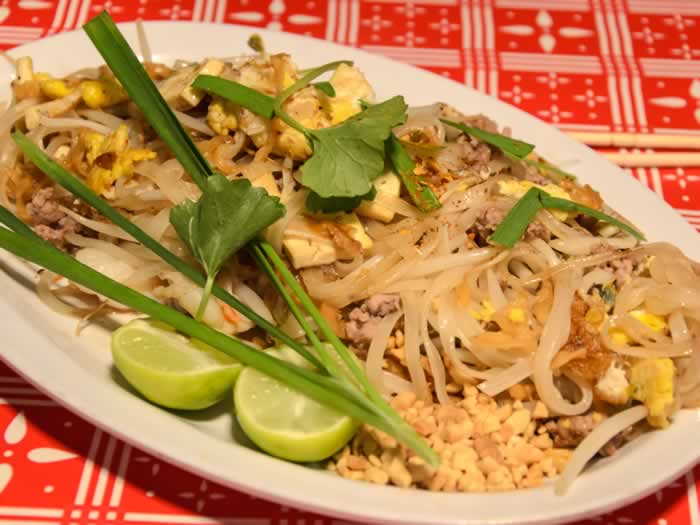 Sen Yai Phat Thai Ruam (Rice noodles stir-fried in rendered pork fat, with prawns, ground pork, dried shrimp, tamarind, fish sauce, palm sugar, peanuts, dried tofu, preserved radish, egg, garlic chives, bean sprouts, and chili powder.)  
